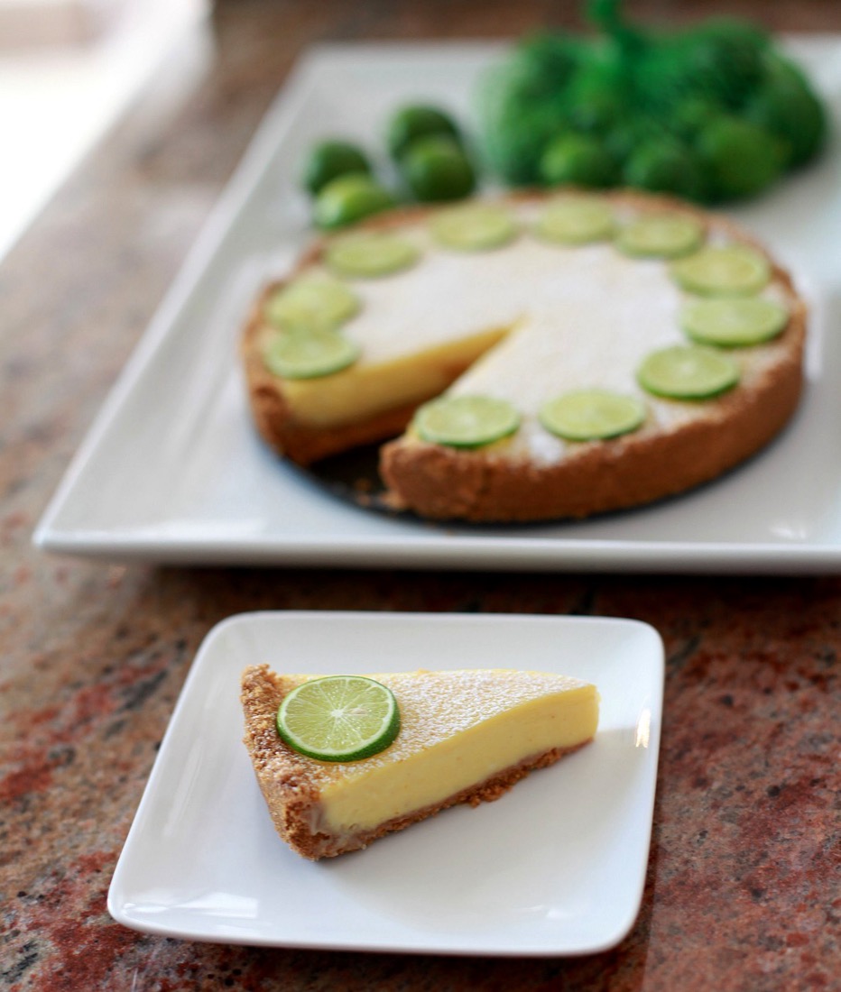 Key lime pie with a slice on a plate