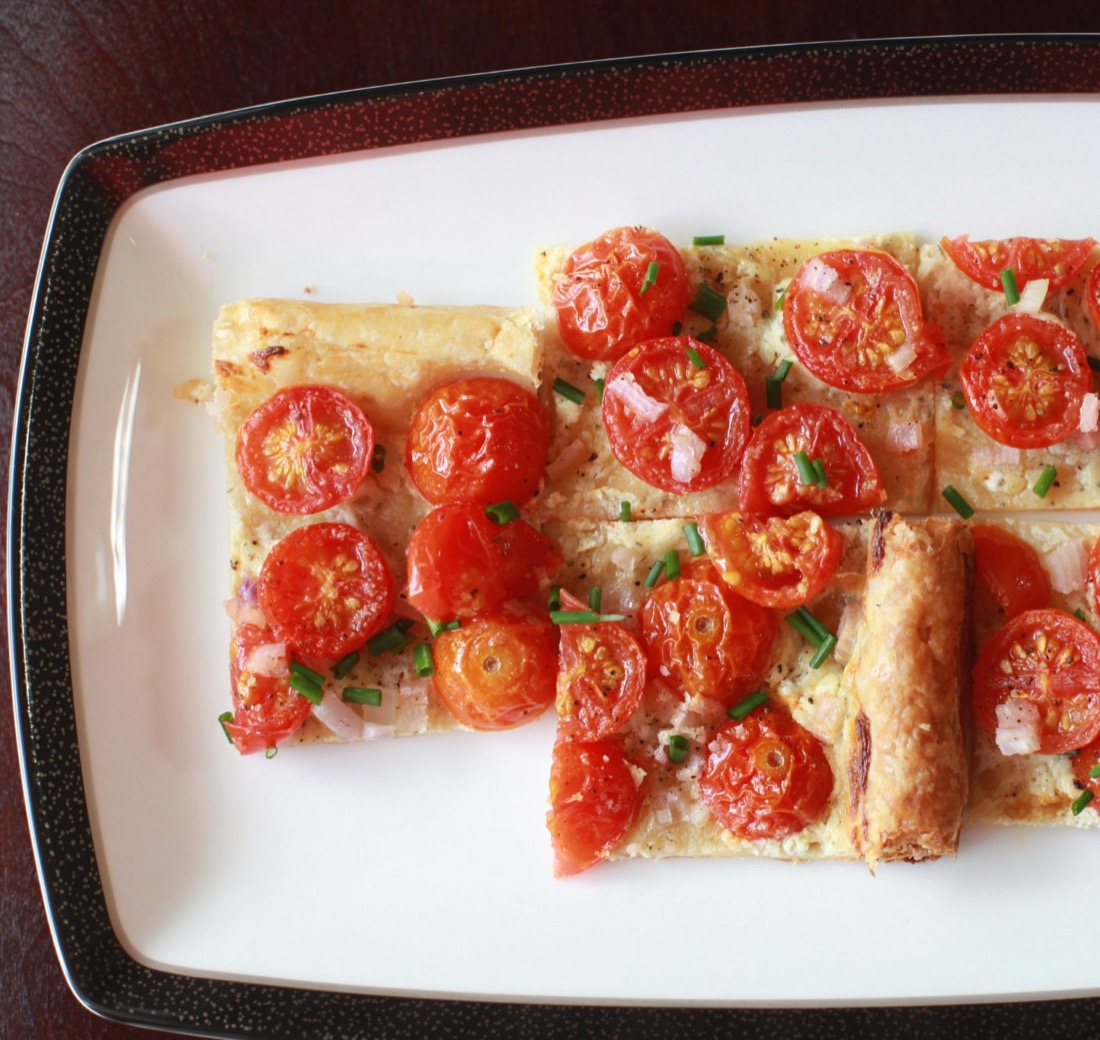 Roasted tomato tart on a white platter
